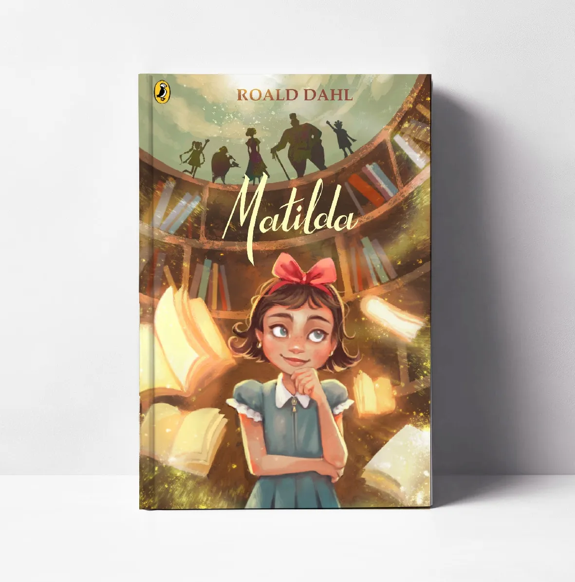 Front cover for Roald Dahl's Matilda shown as a printed hardback: Matilda daydreams beneath a curved bookshelf, the story's characters silhouetted above the title.